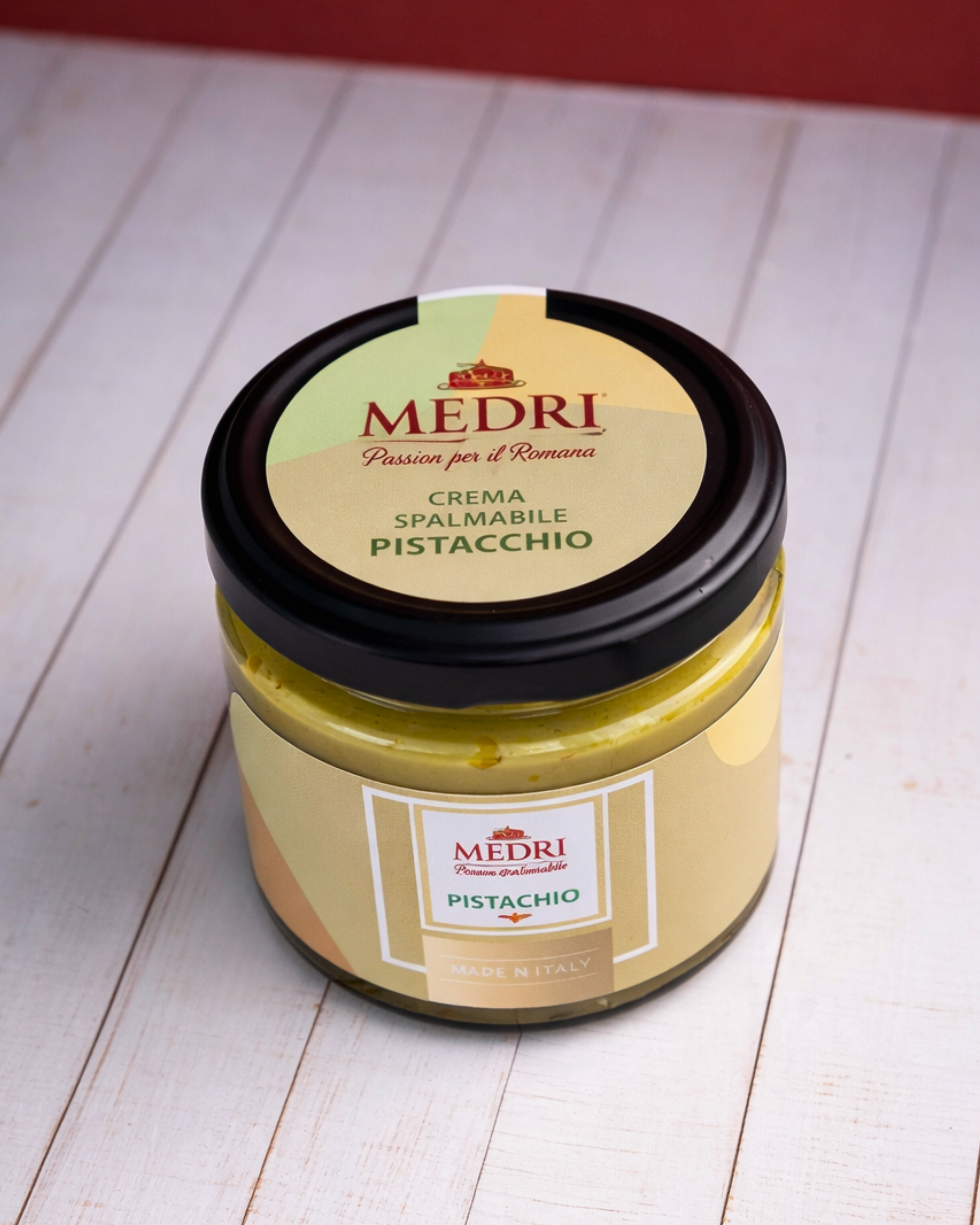 Creamy pistachio spread with 25% pistachio from Medri Tiramisu Cafe, shown in a jar with a smooth green pistachio texture.
