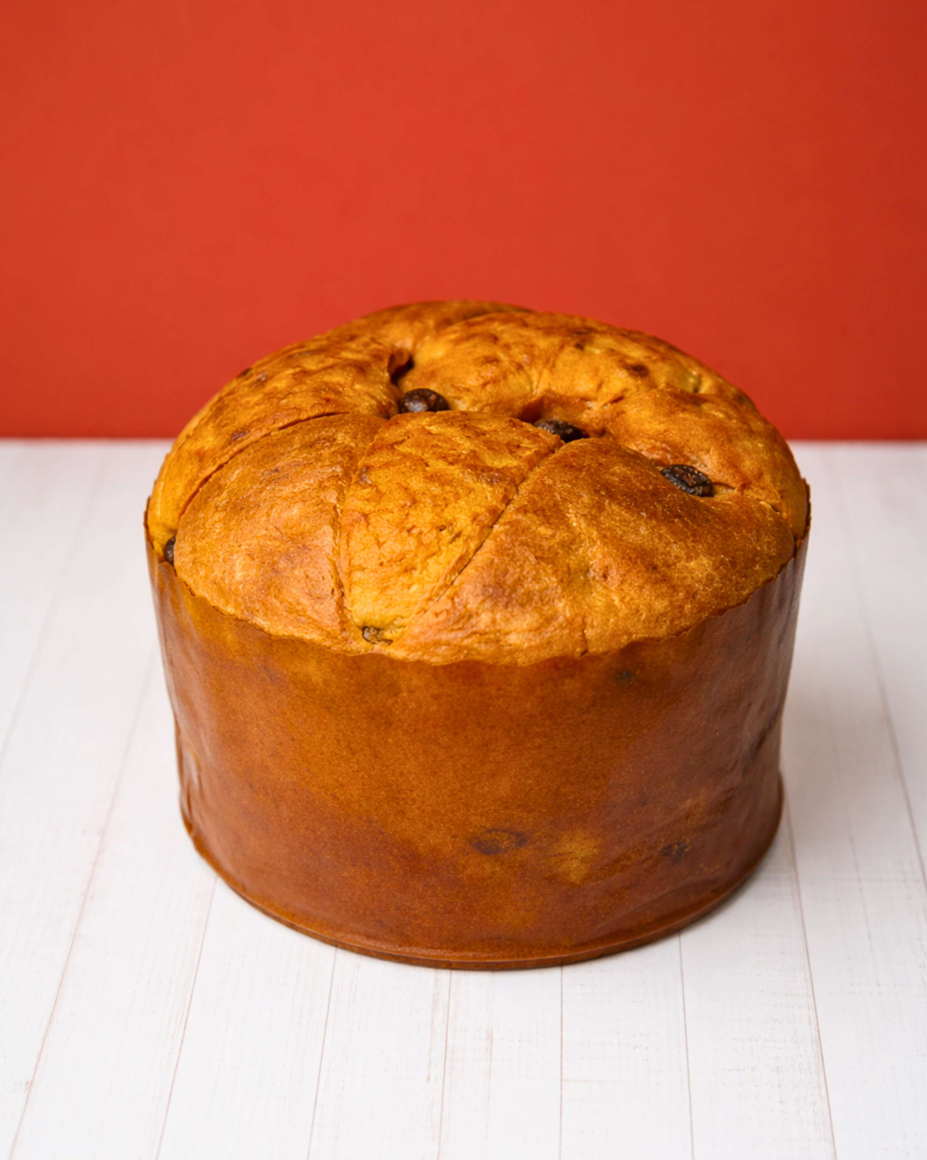 Medri Panettone Classico Negrini, traditional Italian Christmas bread with golden top and festive packaging, sliced to show rich fruit filling.