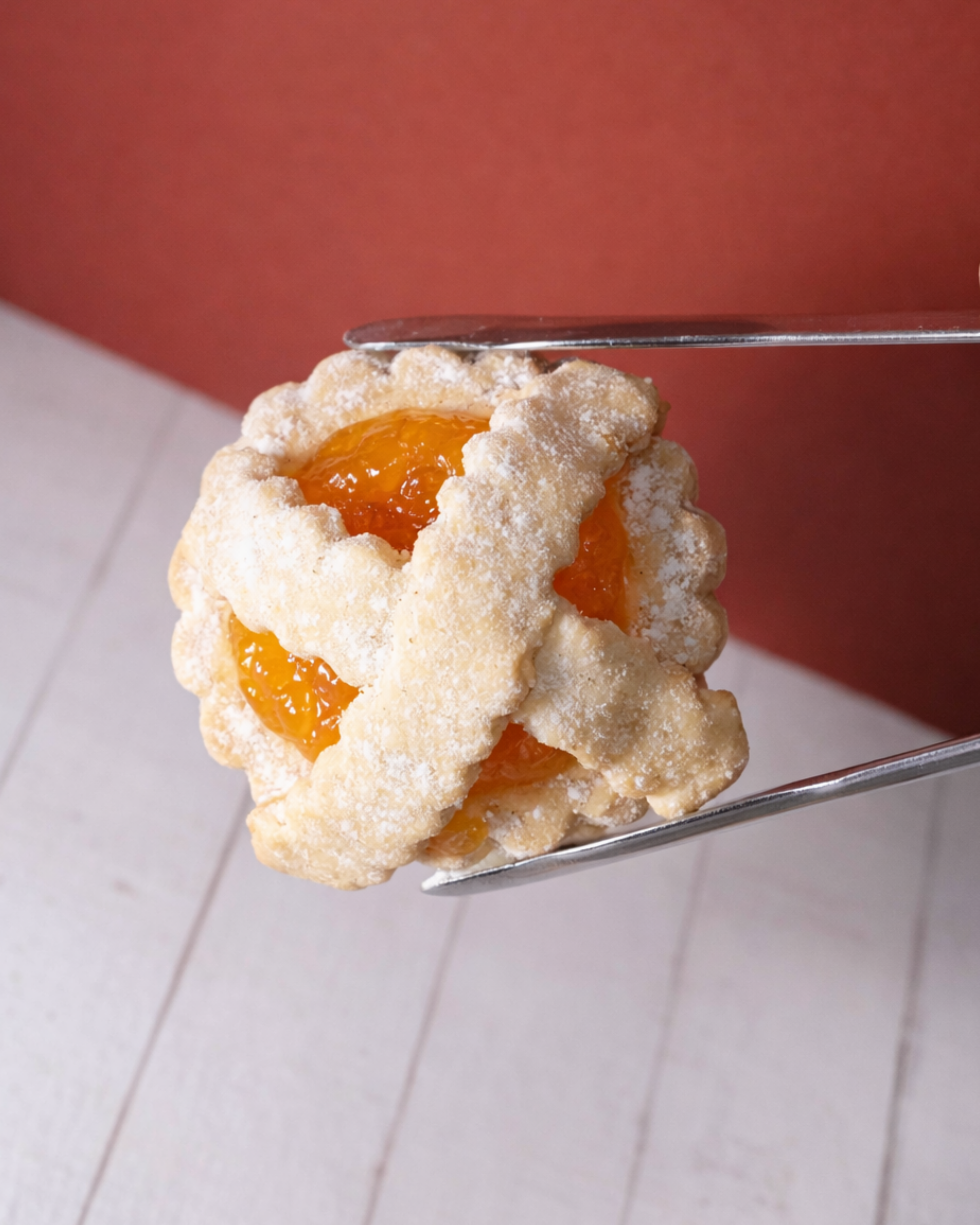Jar of Rustichelle Marmelada by Medri with golden-orange marmalade inside, displayed on a rustic wooden surface.