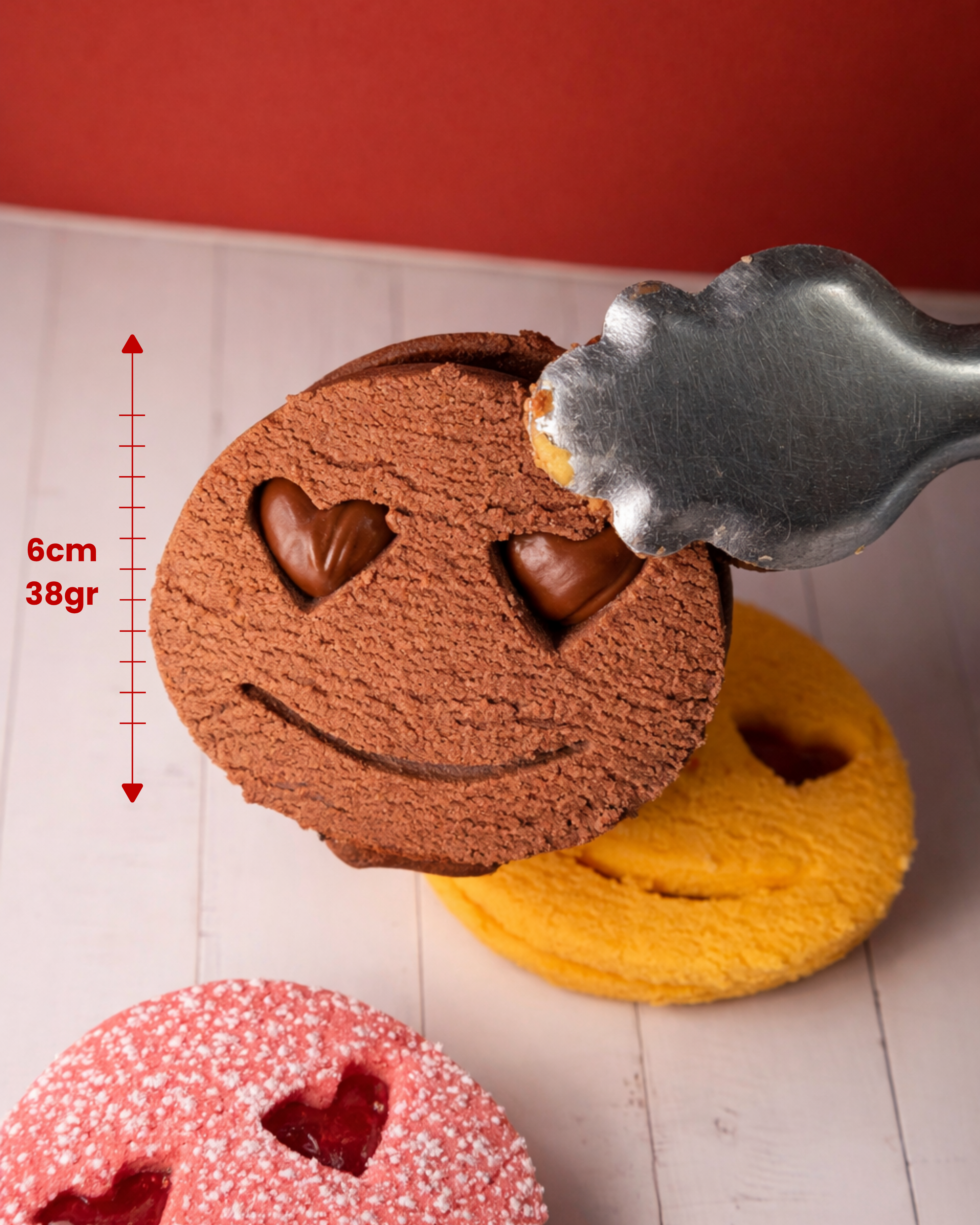 Assorted Medri Faccine candies in a variety of colorful fruit-flavored gummy faces in a box.