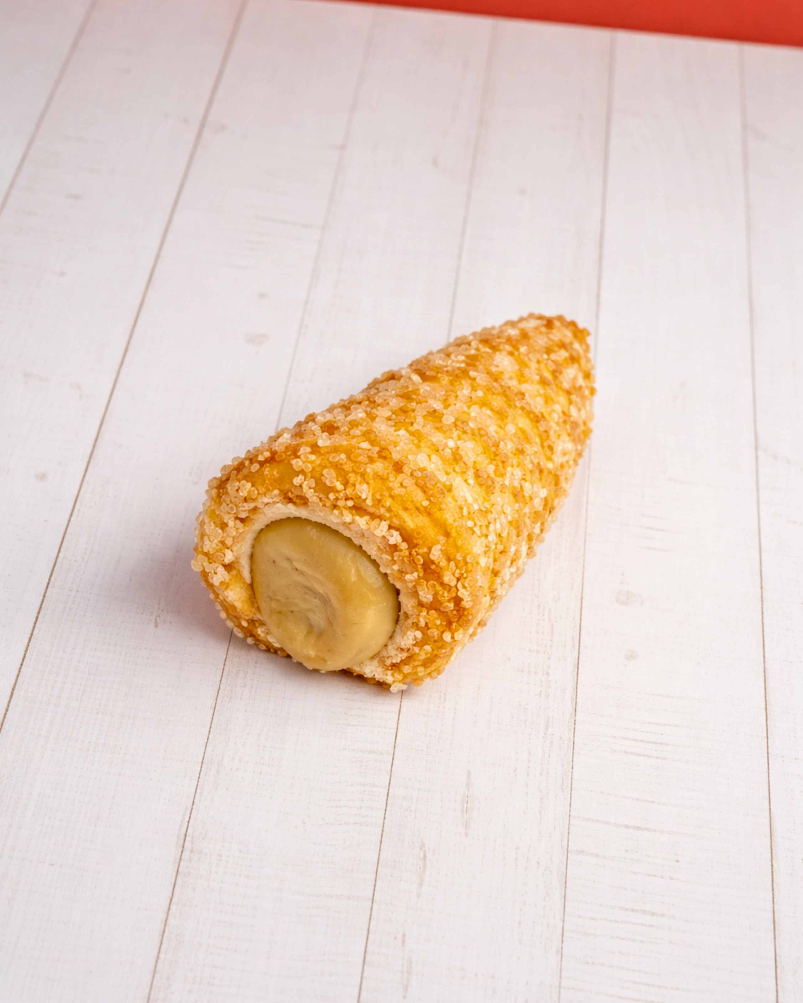 Medri Cannolino Sfoglia Pistacho pastry with pistachio filling and flaky puff pastry exterior.