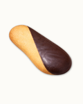 Medri Lengua de Gato Chocolate cookies arranged on a plate, showcasing their crispy texture and rich chocolate coating.