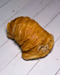 Medri Sfogliatella de Tiramisú pastry with layered, flaky crust and creamy tiramisú filling on a white plate.