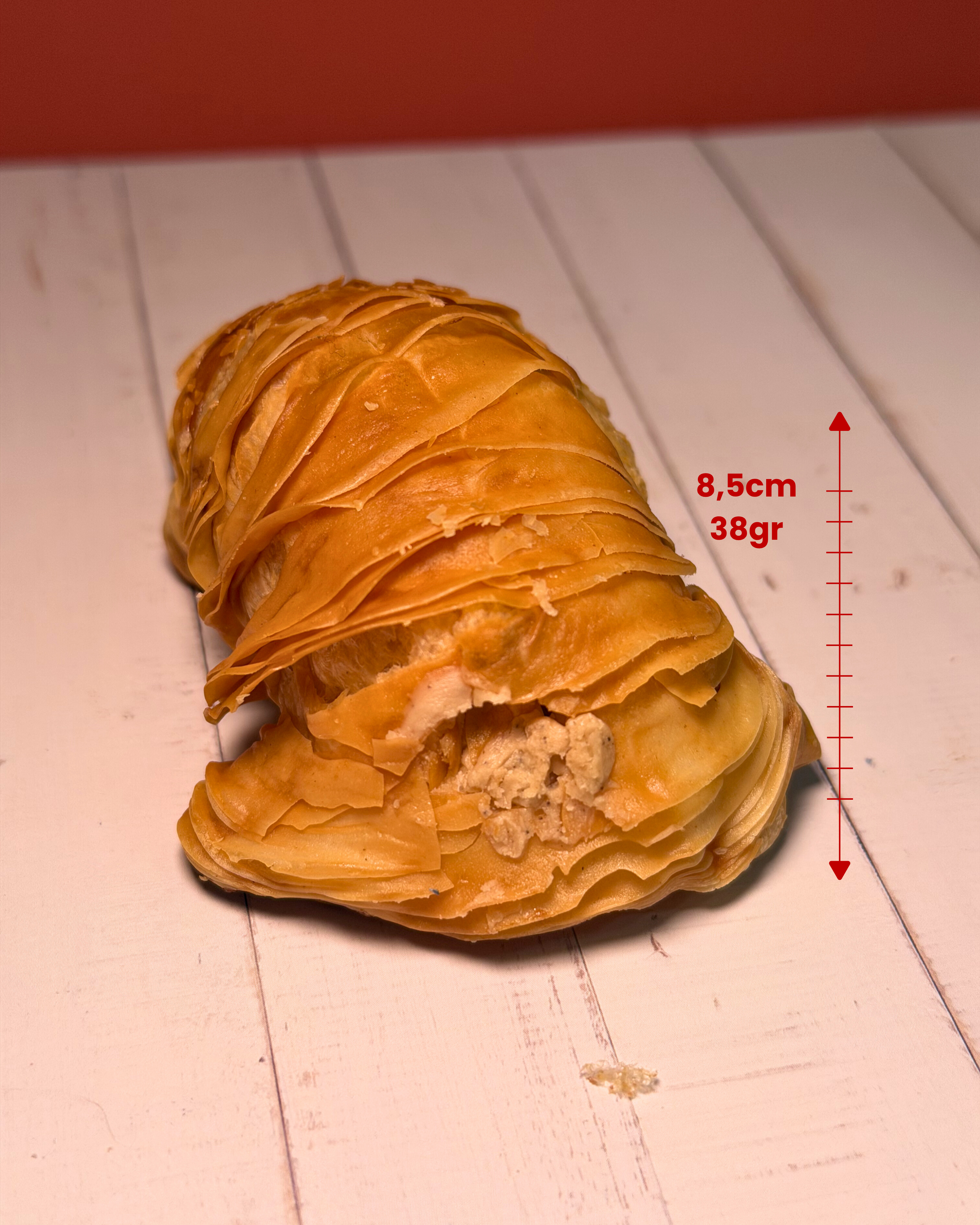 Medri Sfogliatella de Tiramisú pastry with layered, golden crispy shell and creamy tiramisú filling inside.