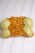 Cannolino Croccanti Pistacho by Medri, crunchy pistachio-filled Italian pastry with a golden crust, displayed on a white plate.