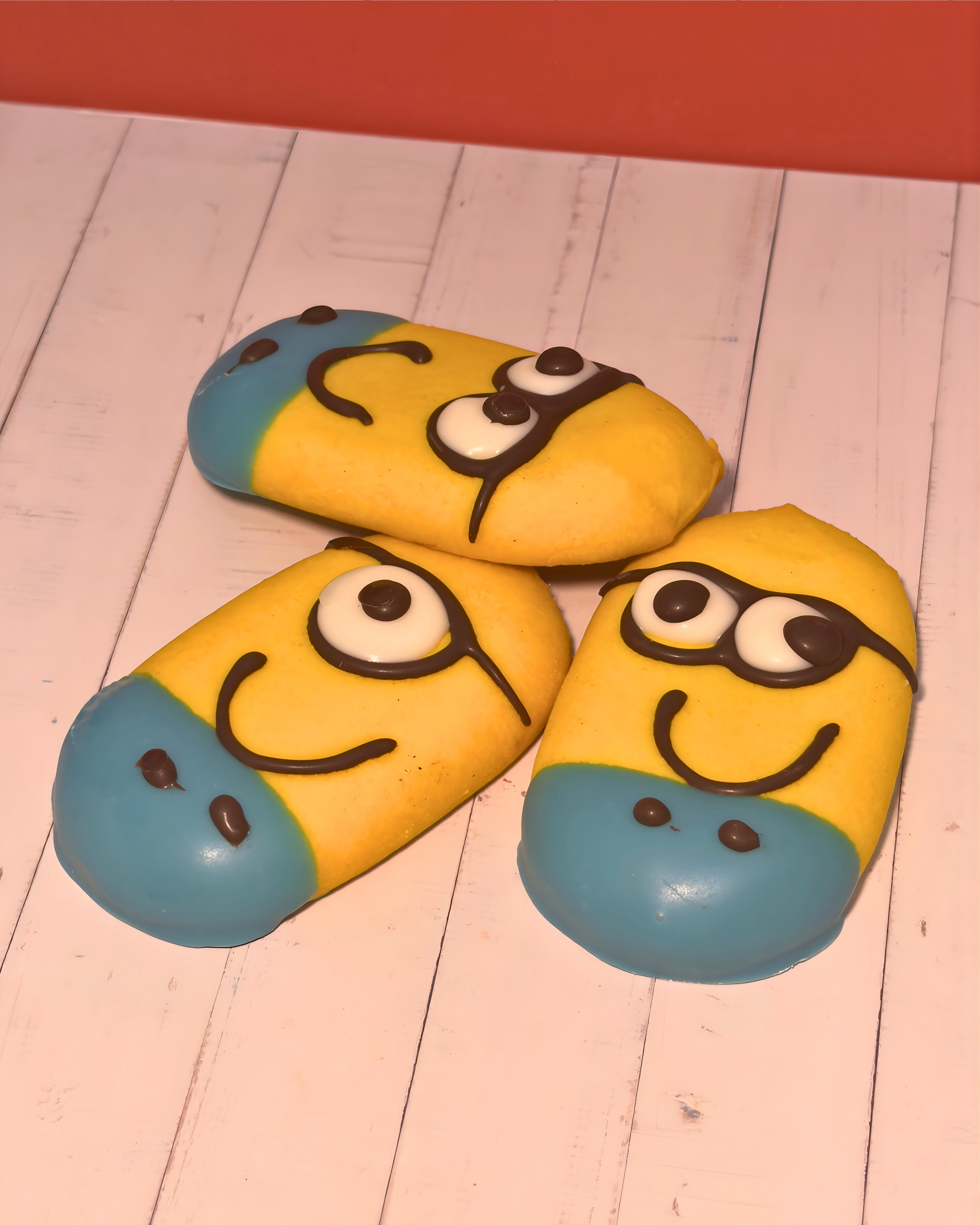 Chocolate-filled Minions pastry from Medri Tiramisu Cafe, showing a golden-brown exterior with visible chocolate filling inside.