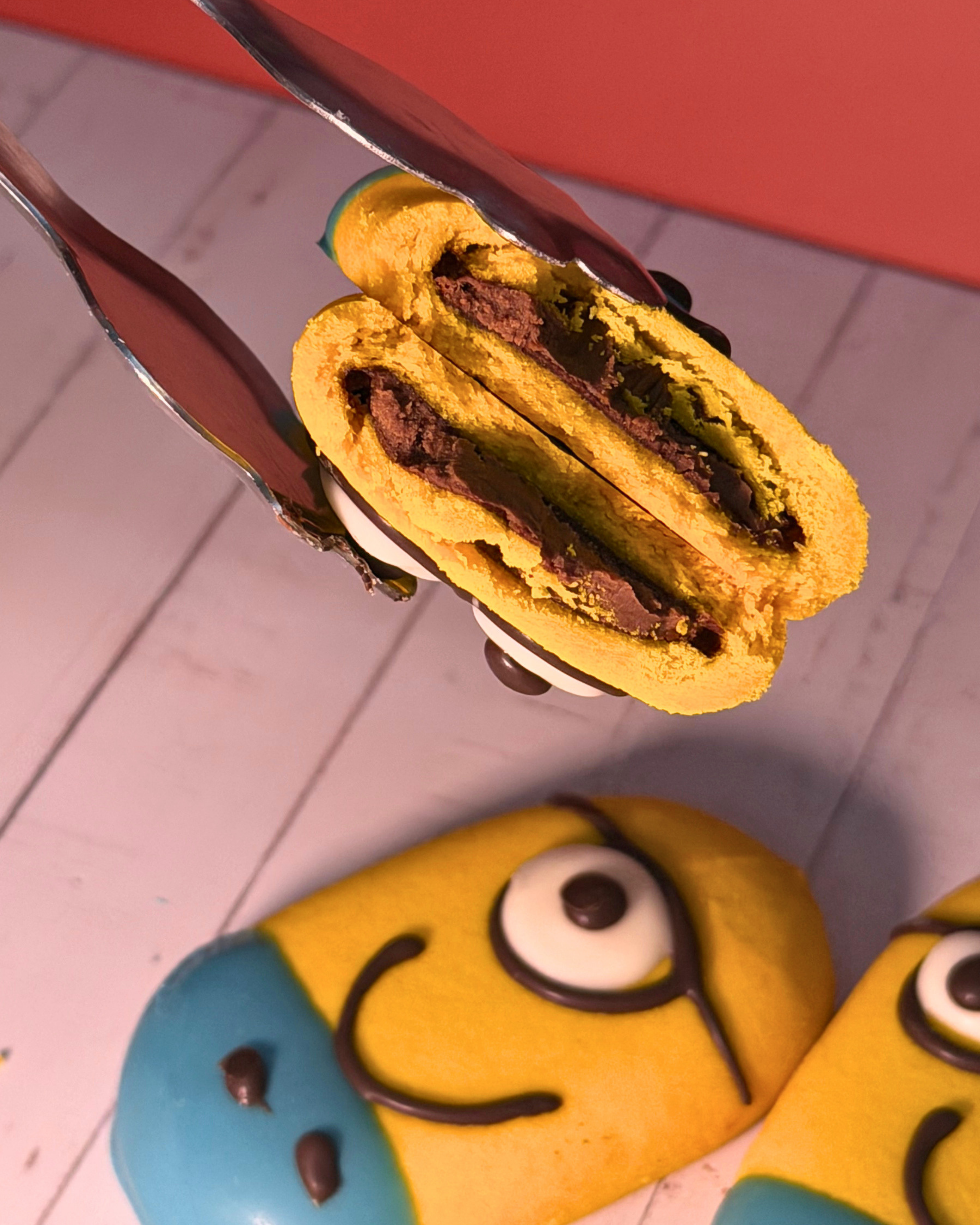 Chocolate-filled Minions dessert by Medri Tiramisu Cafe, featuring playful Minions character and rich chocolate filling.