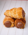 Cannolino Sfoglia Chocolate by Medri, a delicate pastry with chocolate filling and flaky puff pastry exterior.