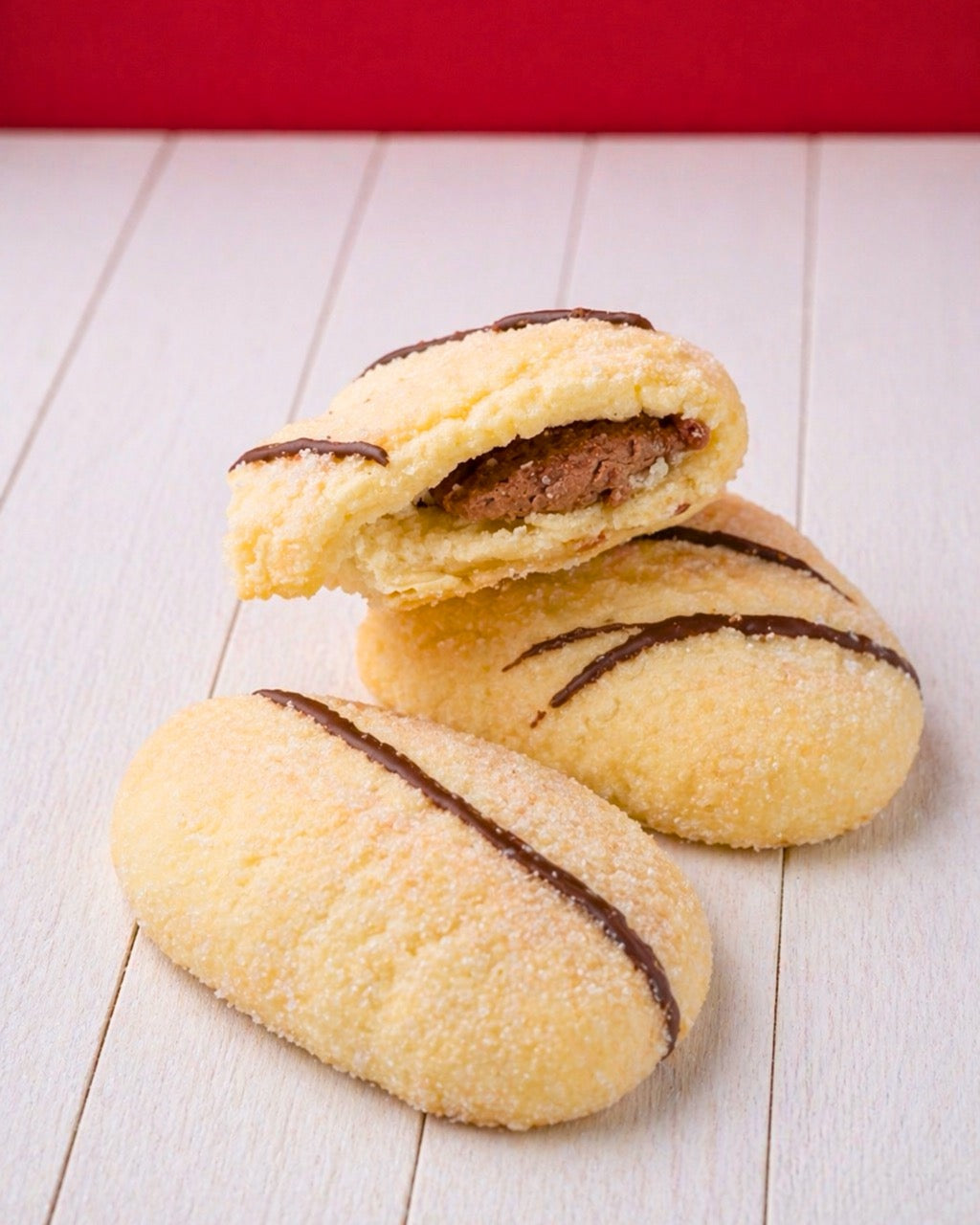 Mini Ciabattine Chocolate by Medri Tiramisu Cafe, small chocolate-filled bread rolls on a plate.