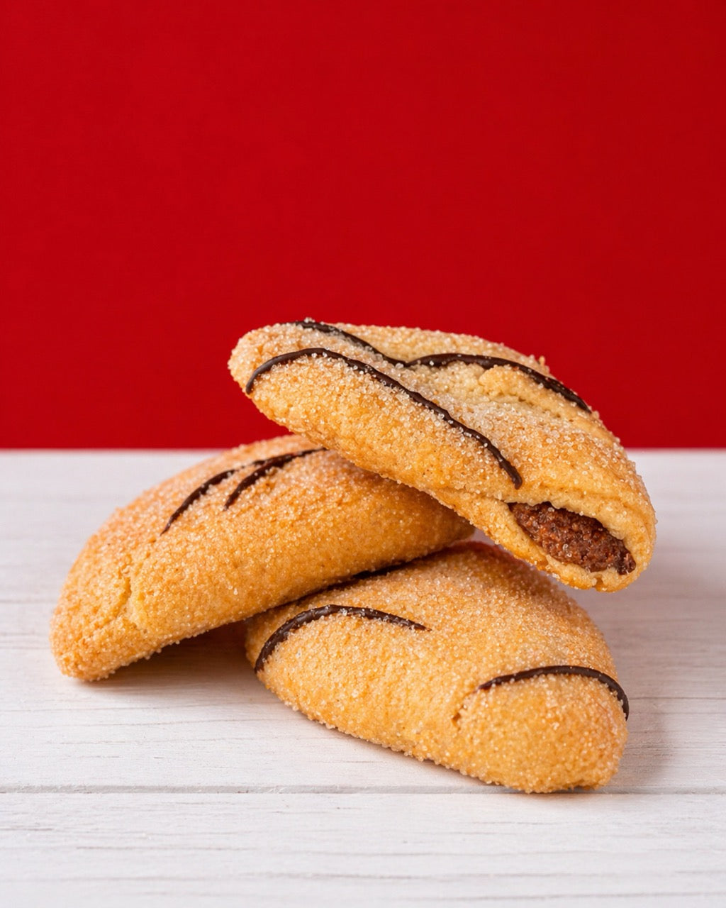 Mini Ciabattine Chocolate from Medri Tiramisu Cafe, small chocolate-filled bread rolls on a white plate.