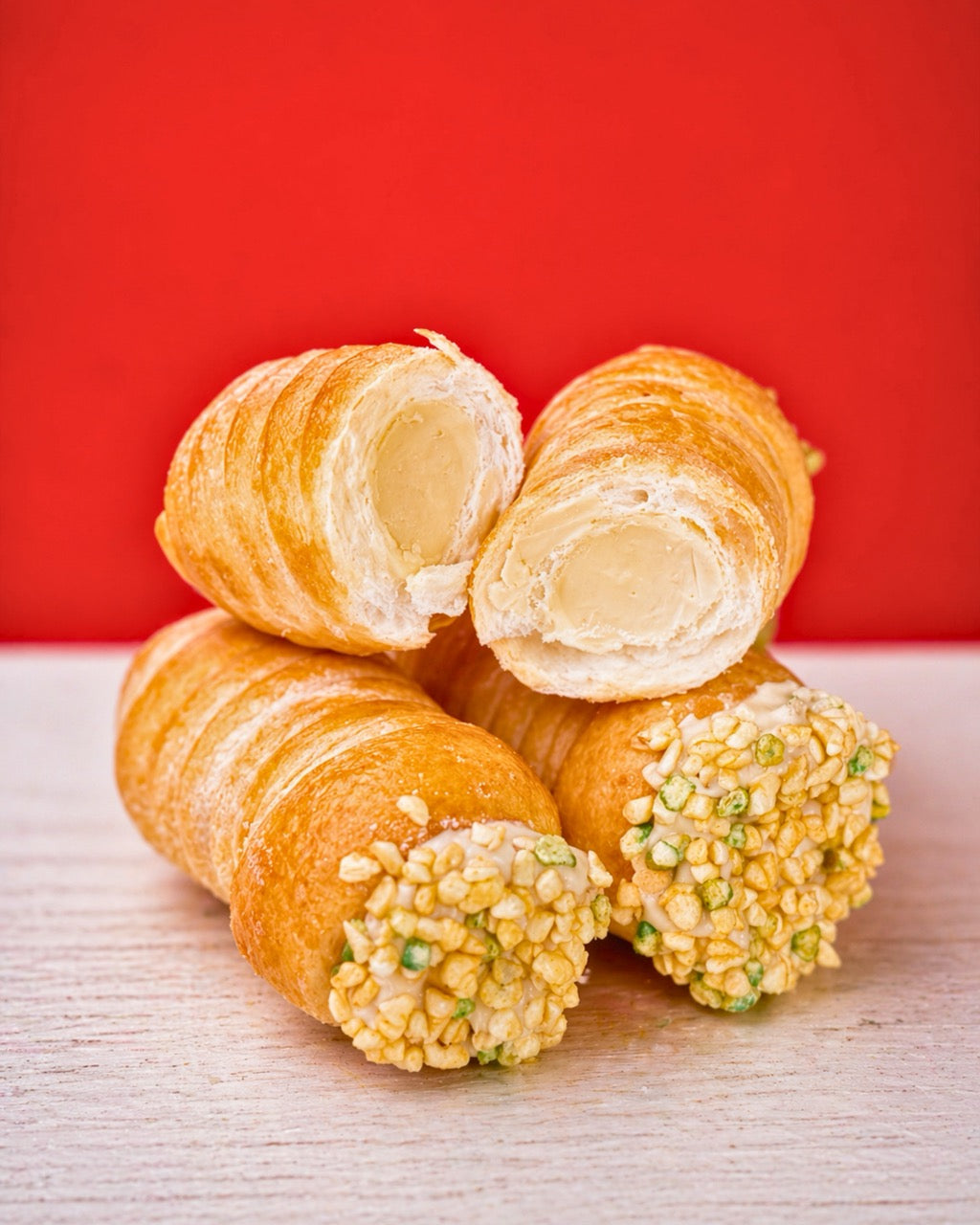 Cannolino with pistachio topping from Medri Tiramisu Cafe, creamy dessert with vibrant green pistachios and delicate presentation.