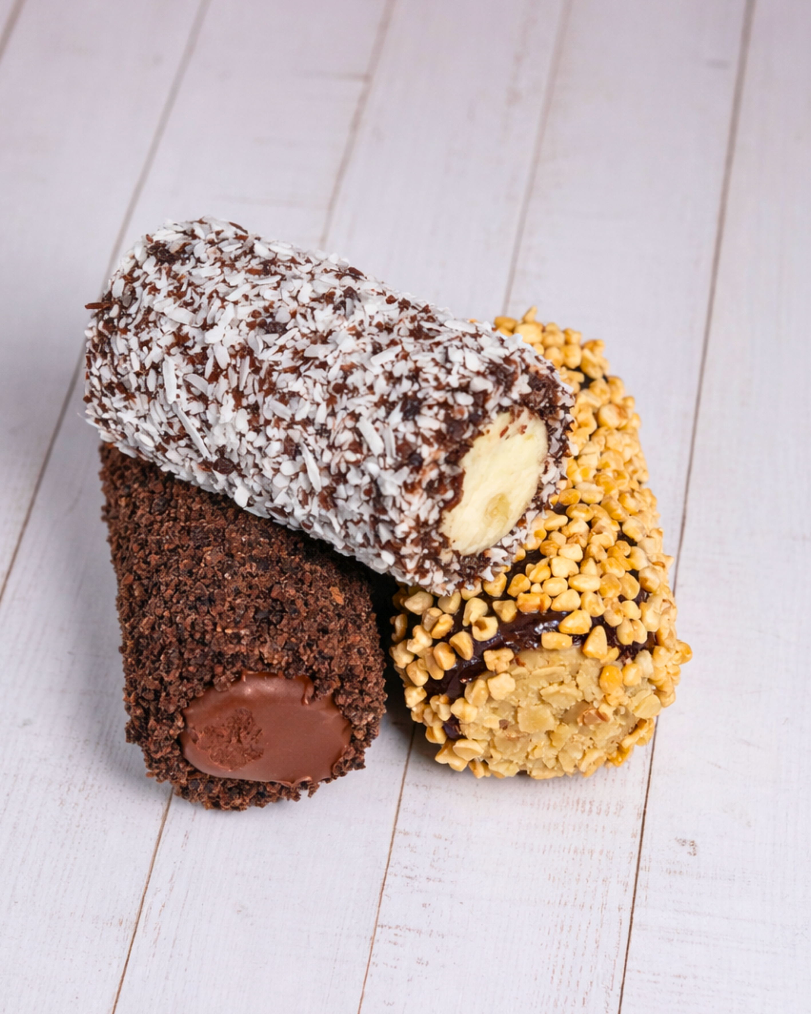 Assorted Medri Cannolli Twill box featuring a variety of colorful, handcrafted cannolli with textured twill packaging.