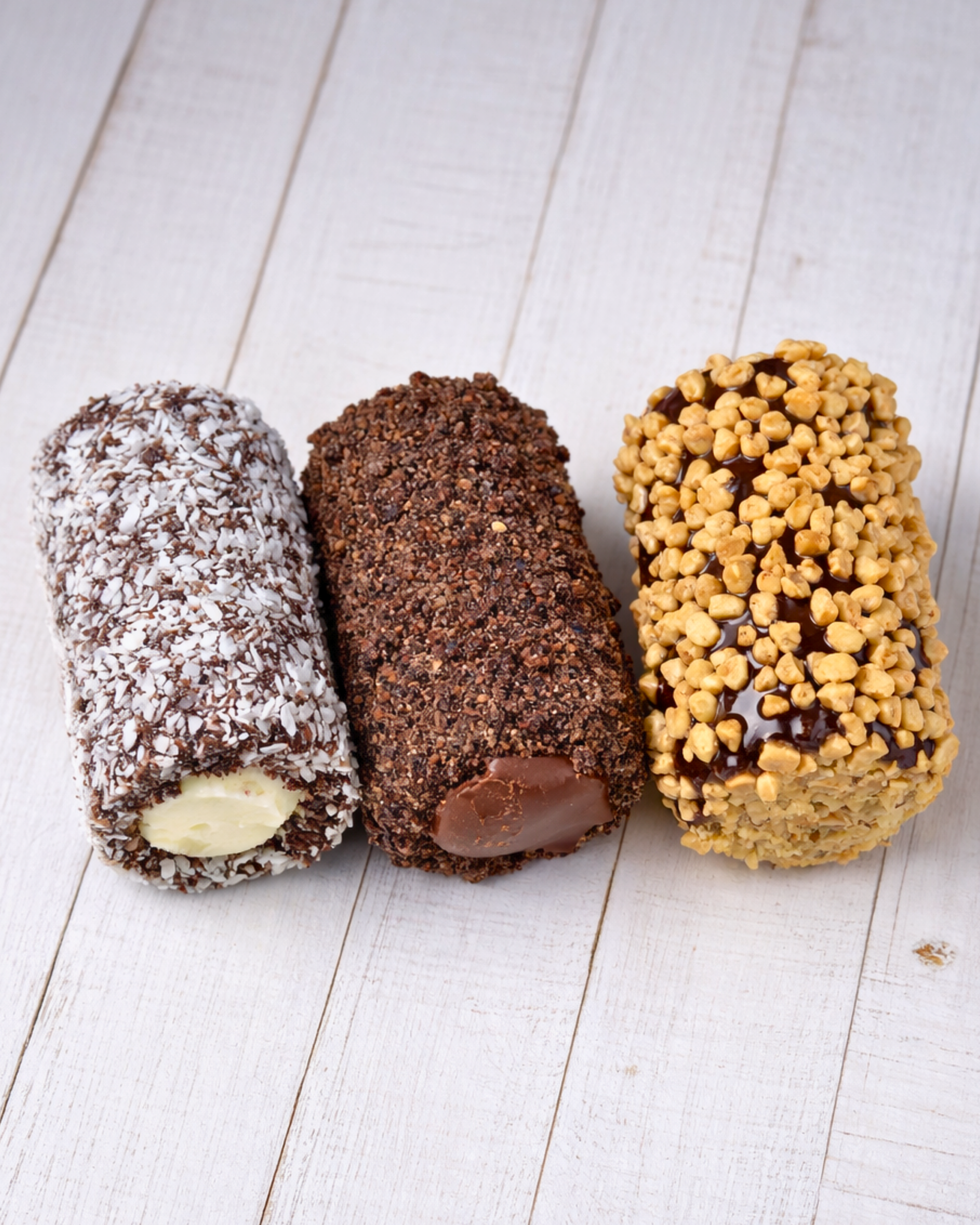 Assorted Medri Cannolli Twill box with colorful, handcrafted Italian pastry cannoli arranged in a decorative display.