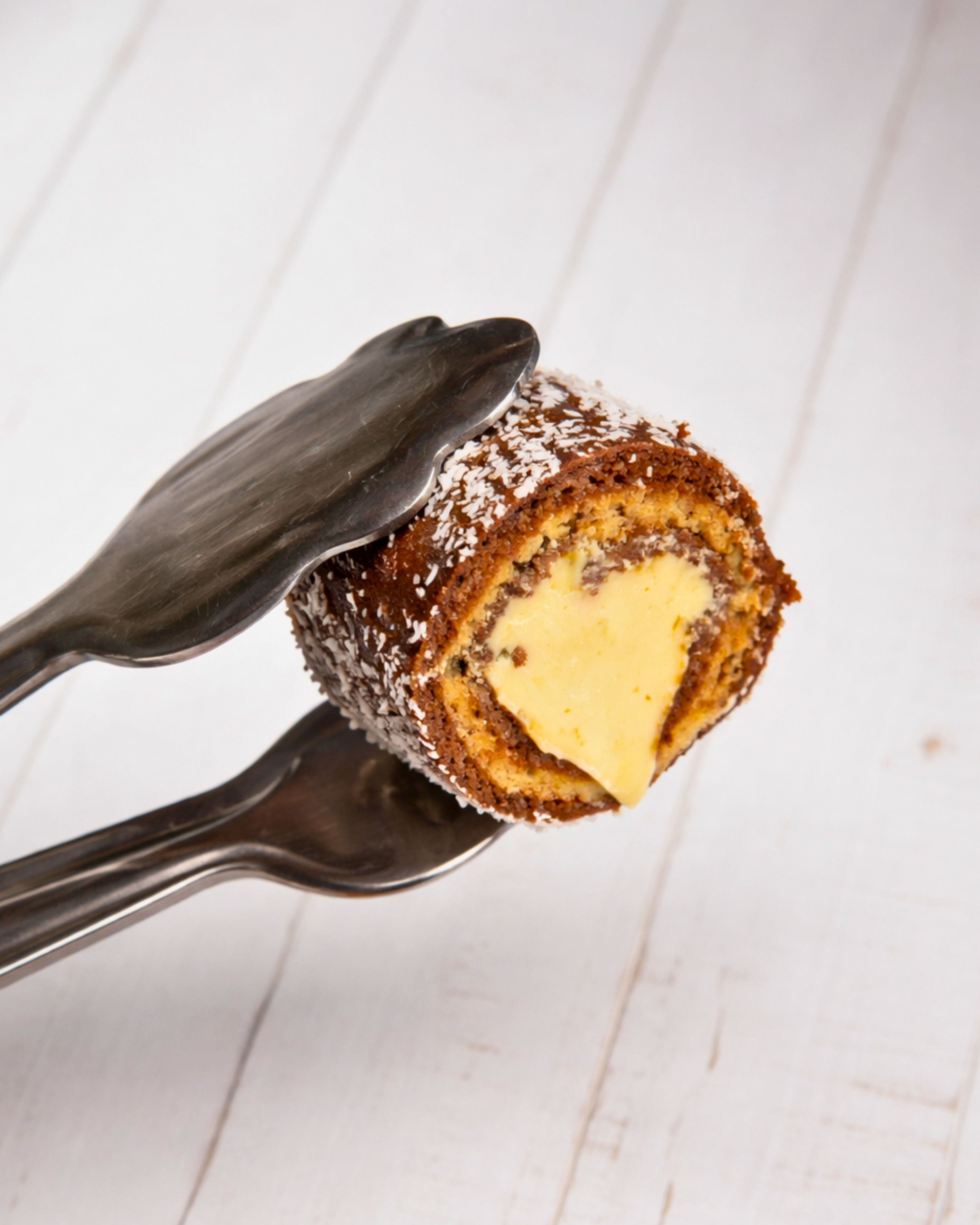 Assorted Medri Cannolli Twill boxes with colorful, textured pastry shells in a variety of flavors, presented in a decorative box.