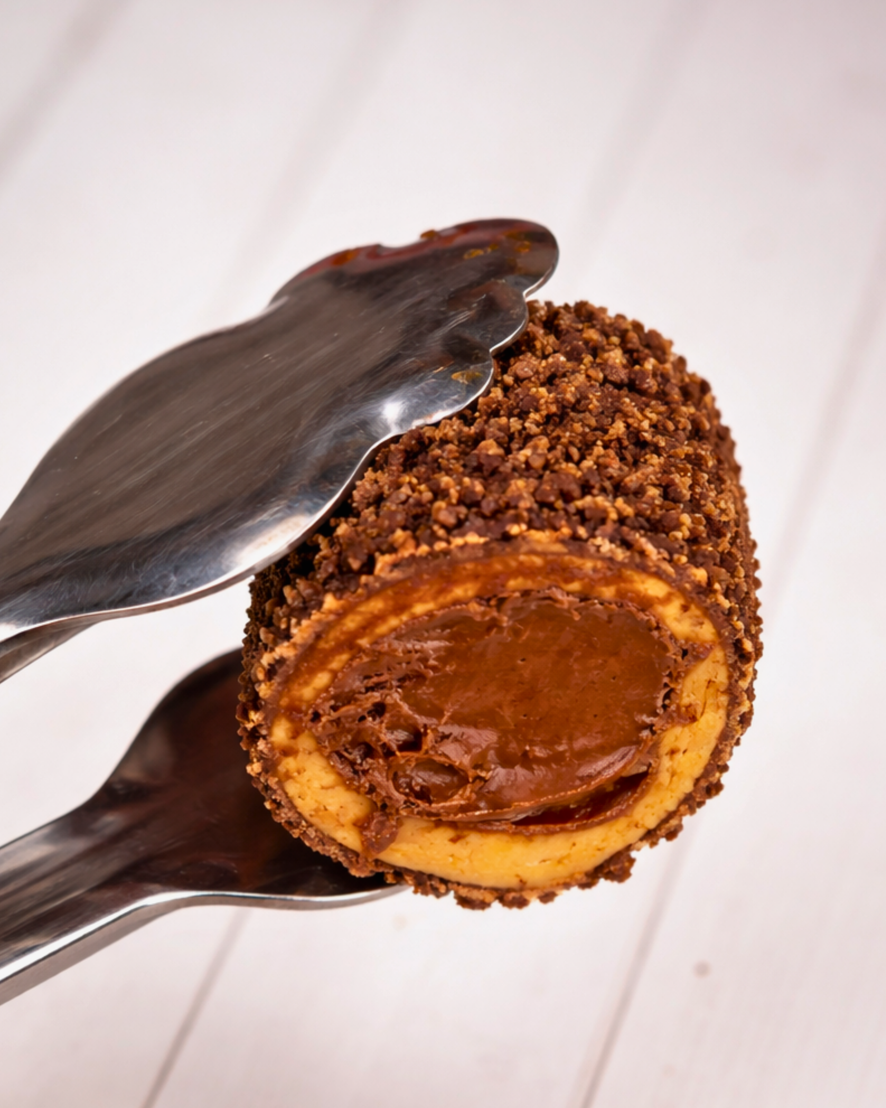 Assorted Medri Cannolli Twill box with colorful, decorative cannolli pastries on display.